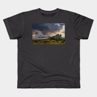 Bamburgh Castle in Stormy weather Kids T-Shirt